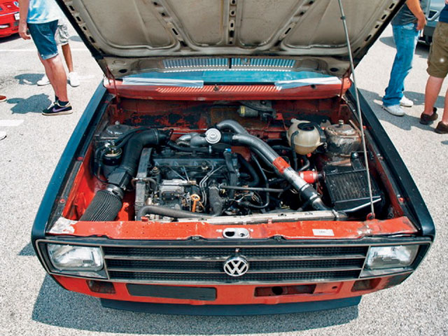 Home-tuned engine bay of a Brazilian VW Caddy. At least the filter doesn't suck hot air