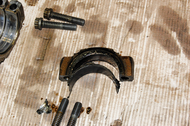Worn, burnt and collapsed: the con-rod bearing. Other cylinders have also shown some degree of wear, albeit less grave than here.