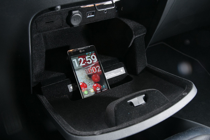 The slot on the lid doubles as a mobile phone stand