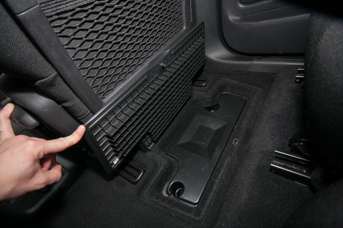 One of the floor compartments is taken up by the JBL audio 