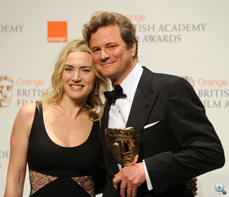 UNITED KINGDOM, London : British actor Colin Firth (R) poses for photographers with British actress Kate Winslet after winning his British Academy of Film Award (BAFTA) for 'Leading actor' for his role in ' A Single Man' at the Royal Opera House in central London, on February 21, 2010. AFP PHOTO/Ben Stansall