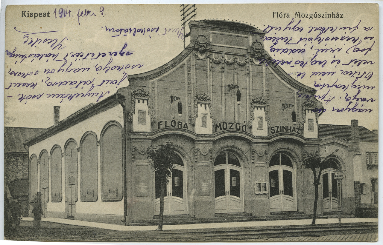 A kispesti vándormozis, özvegy Mutschenbacher Antalné 1909-ben határozta el, hogy állandó helyet keres vállalkozásának. Az egykor Üllői út 116. alatt álló épület helyét nehéz lenne ma megtalálni a sok egyforma paneltorony között, annyira legyalulták a hetvenes években a városrendezők a környéket. A kispestiek számára a 700 fős Flóra mozi a kultúra színvonalas közvetítője volt, mert a mozi mellett színielőadásokat is tartottak itt. Neve a negyvenes években Honvédra változott, majd visszakapta egy rövid időre eredeti nevét, ám az épületet ez már nem mentette meg. Nem sokkal később bezárták és kihasználatlanul árválkodott a villamos sínek mellett, mígnem a városrész szanálásakor ezt az épületet sem tartották megőrzendő értéknek.