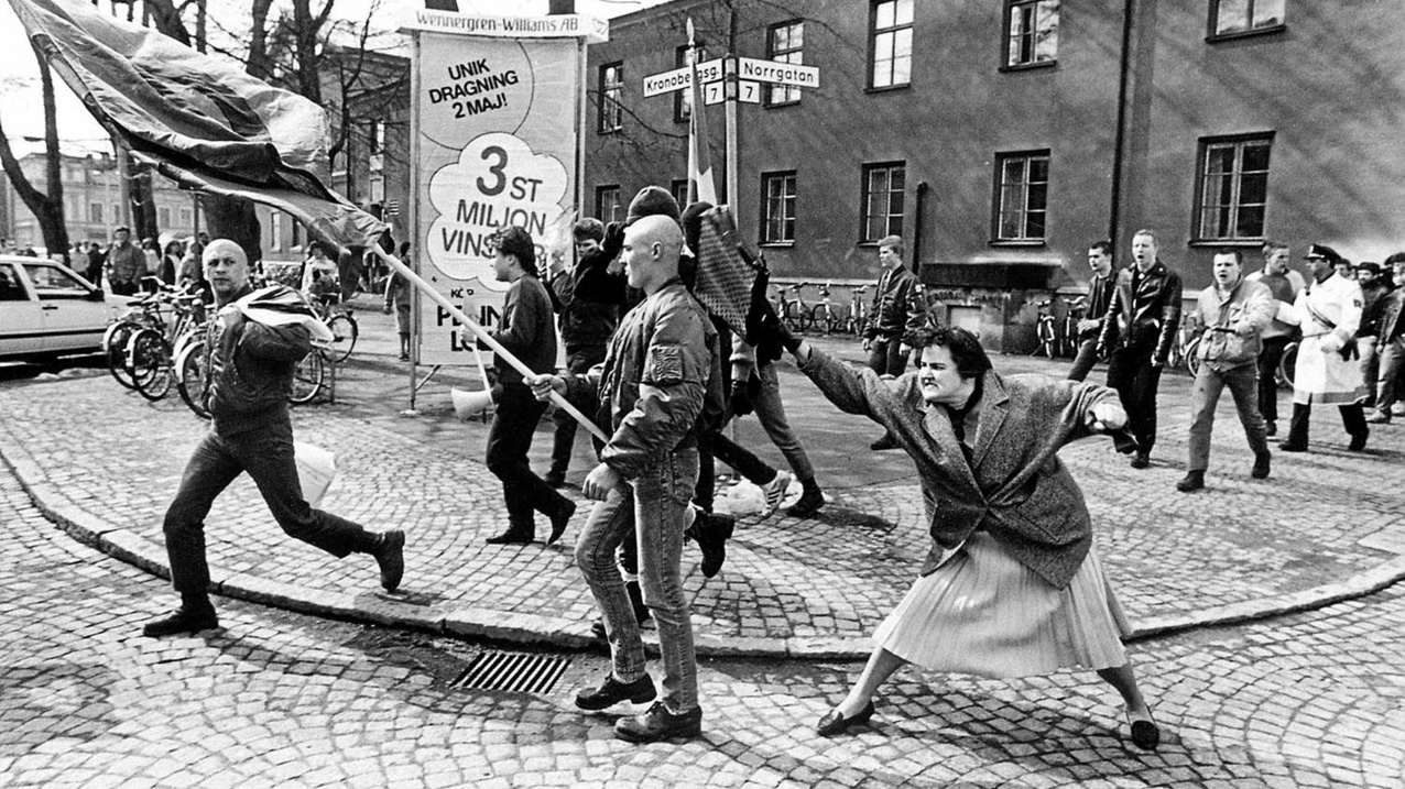 A woman hitting a neo-Nazi with her handbag, Sweden, 1985