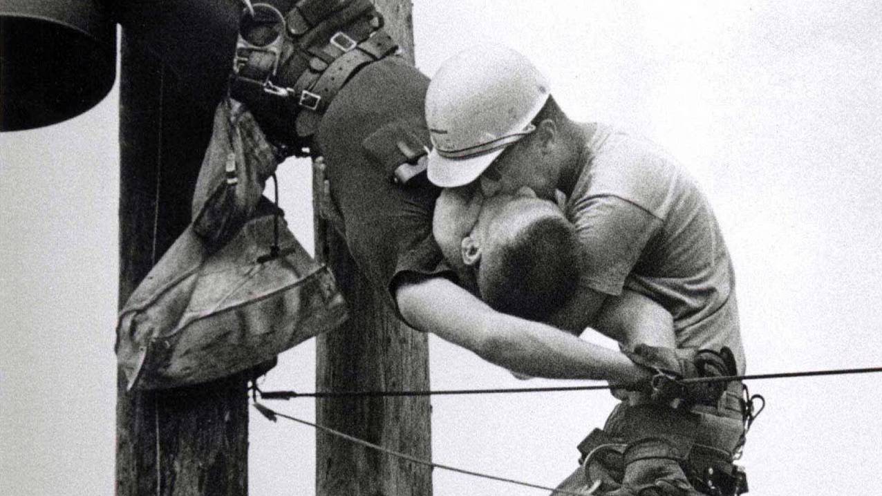 The Kiss of Life - A utility worker giving mouth-to-mouth to co-